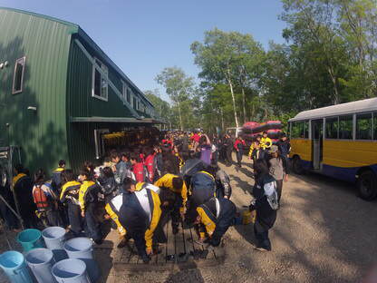 Getting out of our rafting gear after school rafting tour